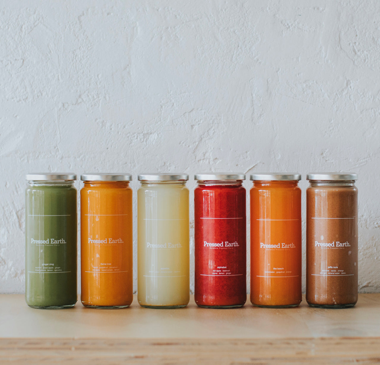 Pressed Earth autumn seasonal detox juice cleanse with six cold-pressed juices in recyclable glass bottles Perth