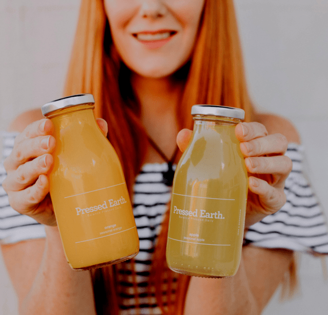 Pressed Earth juice pack of fresh orange and apple juice for events and catering in recyclable glass bottles Perth