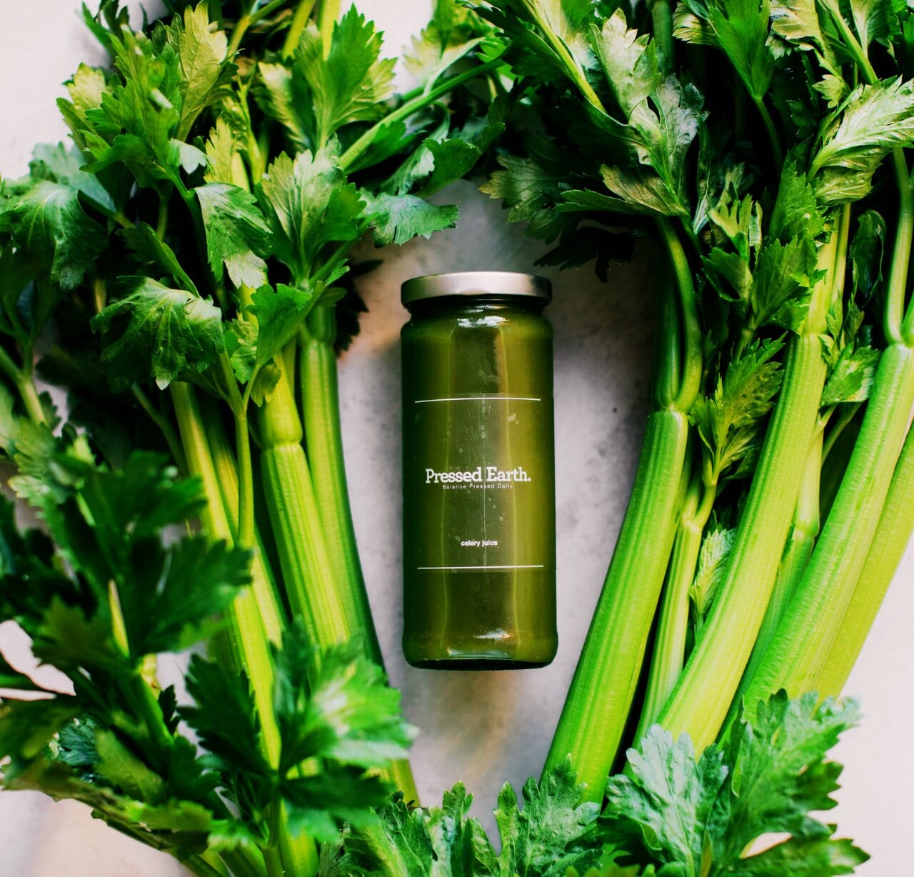 Pressed Earth cold-pressed raw celery juice in a pack of 5 glass bottles Perth